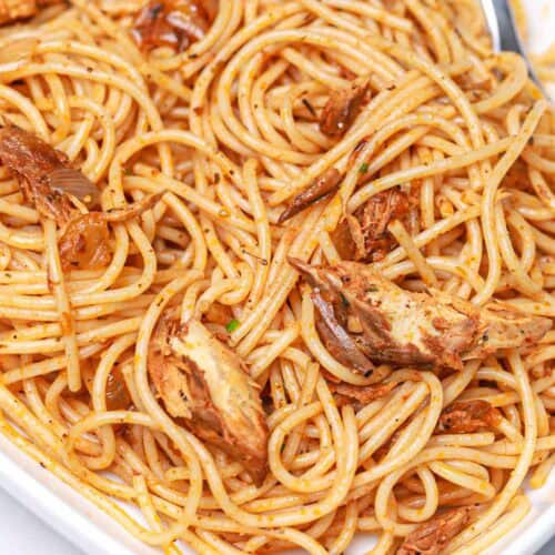 canned mackerel pasta in a white bowl.