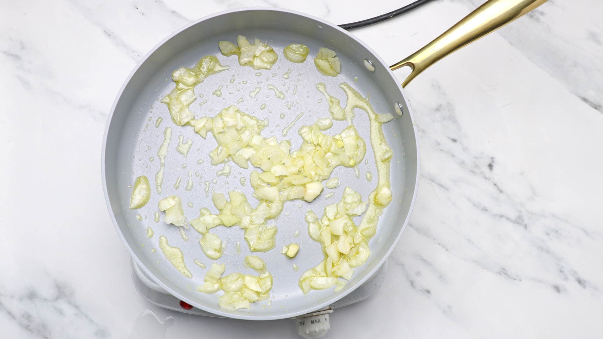 sauteed onions in a pot.