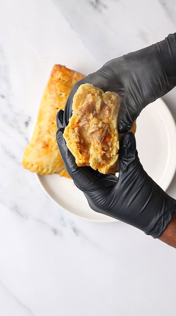 chicken hand pie cut into halves.