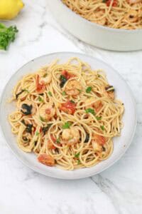 lemon butter shrimp pasta served on a plate.