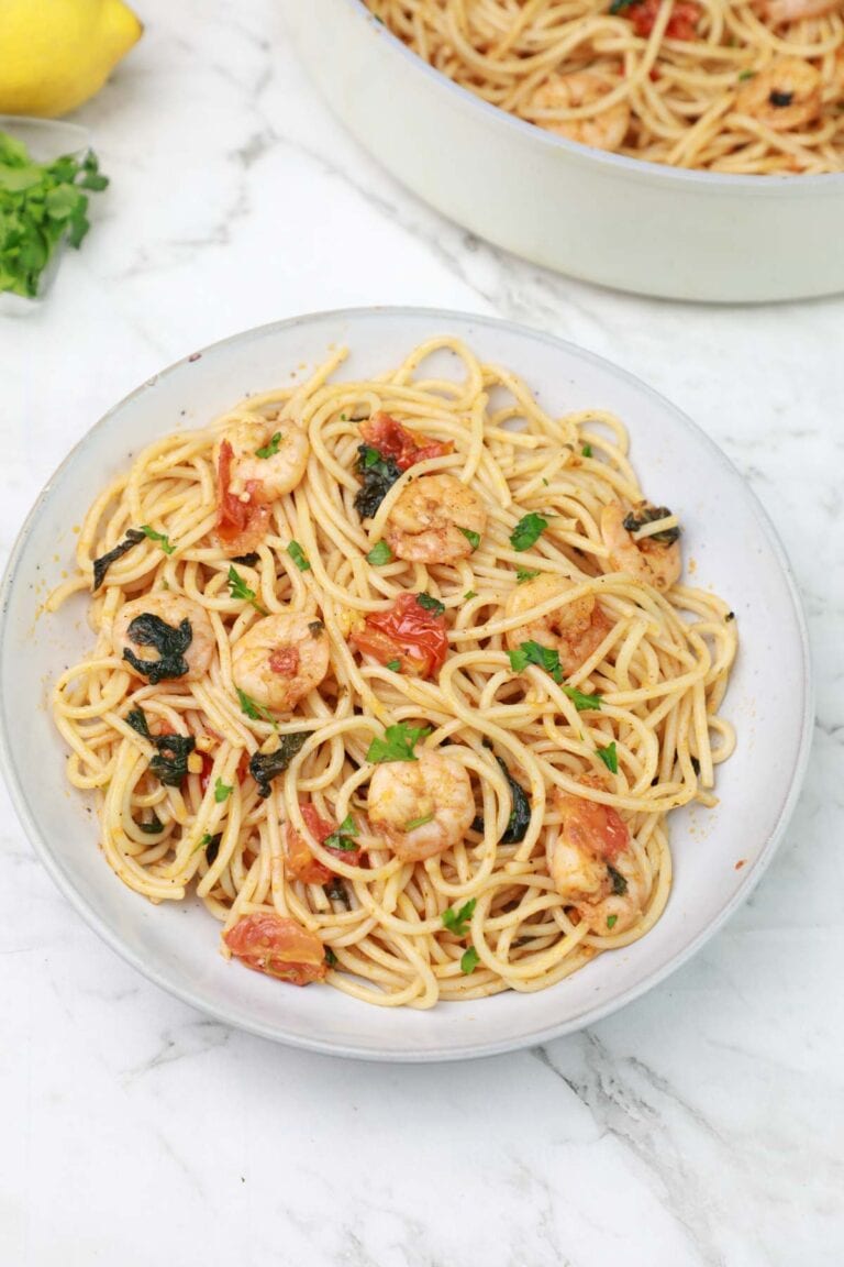 lemon butter shrimp pasta served on a plate.