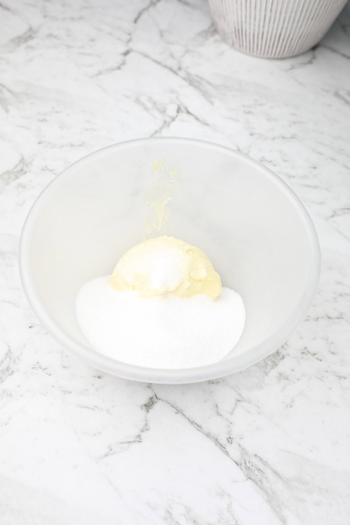 sugar and butter in a mixing bowl.