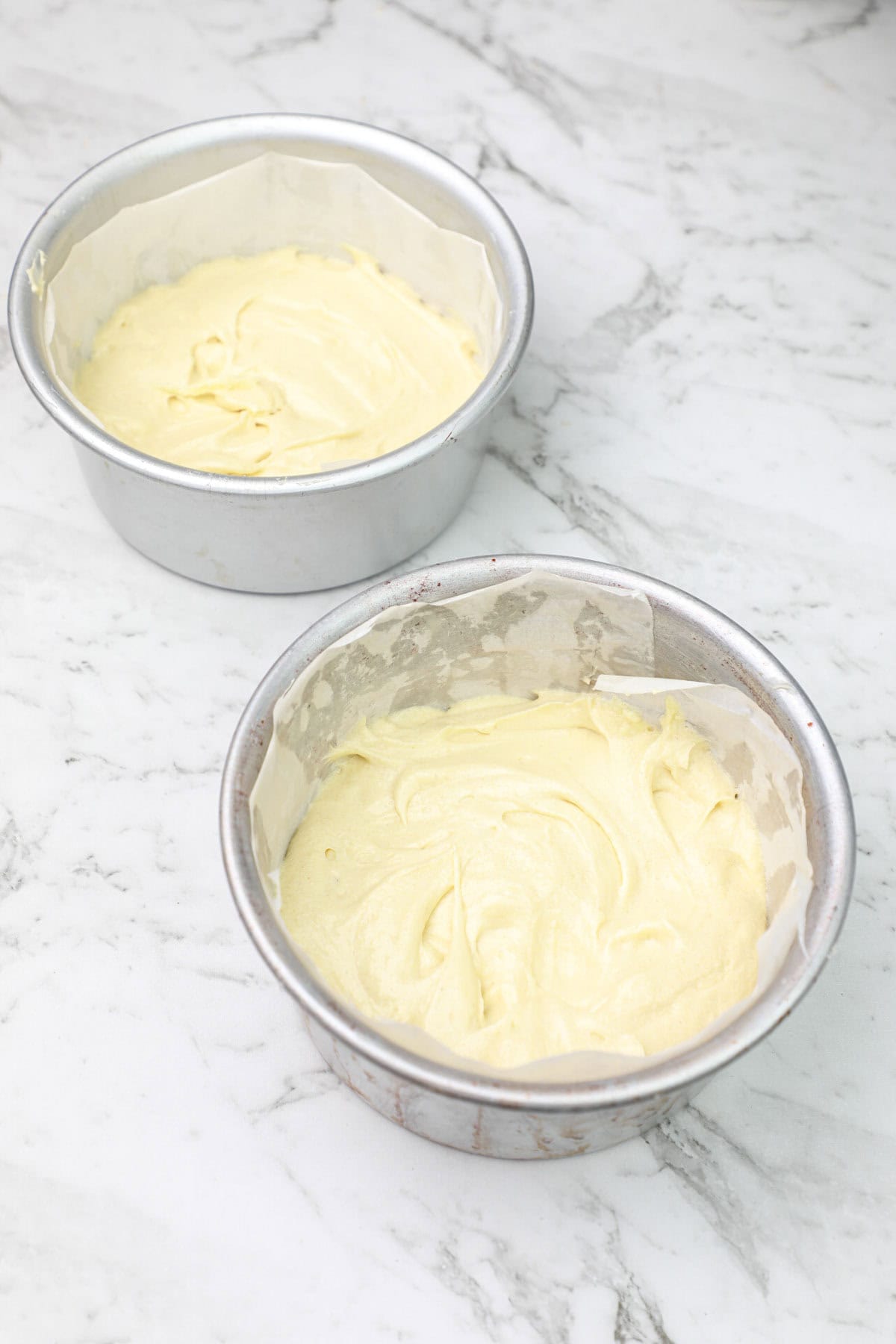cake batter divided into two pans.