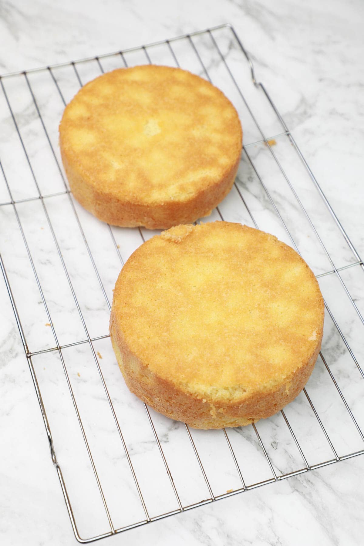 cakes cooling on a cooling rack.