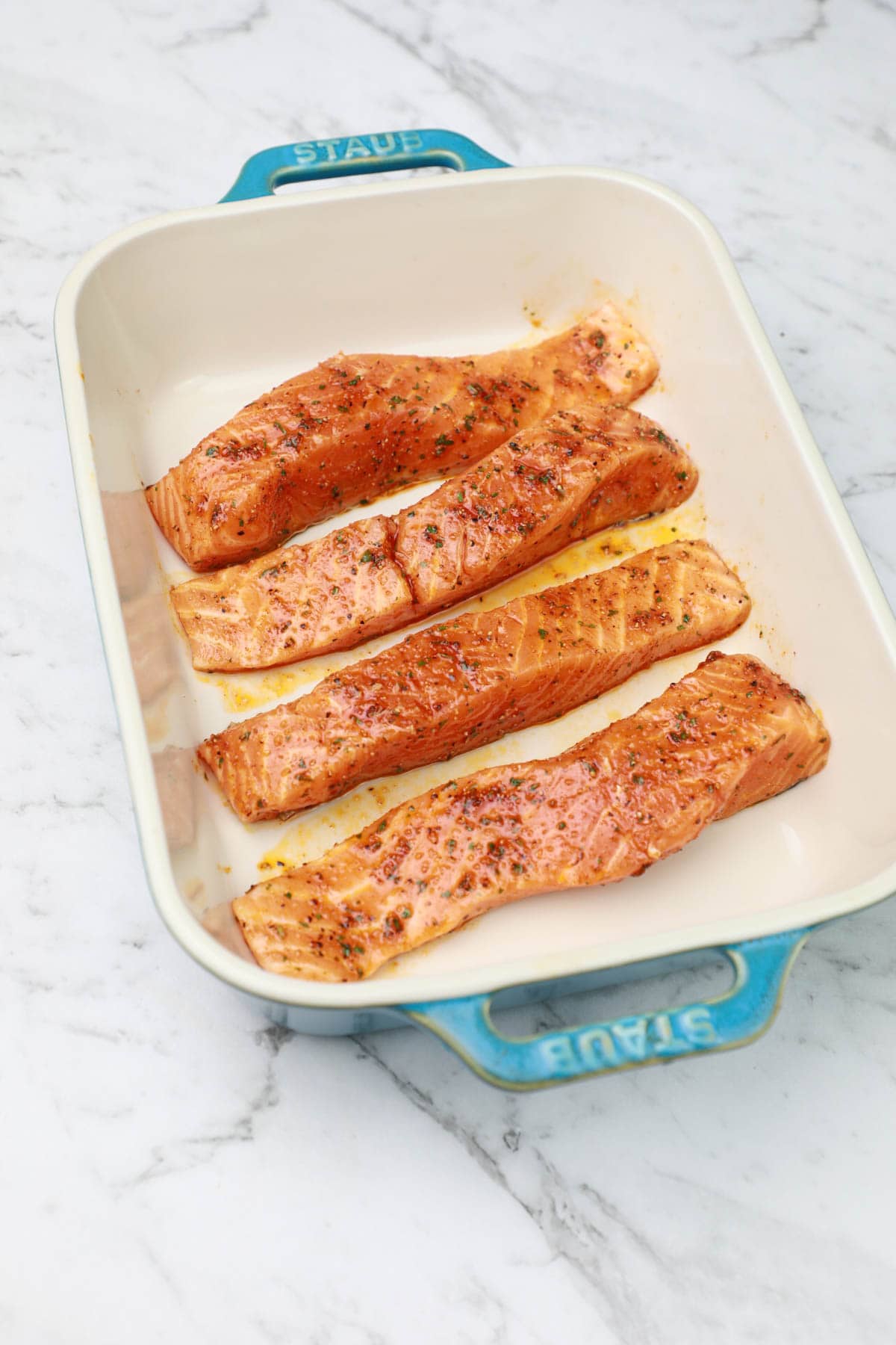 salmon arranged in a baking dish.