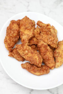 fried chicken strips in a bowl.